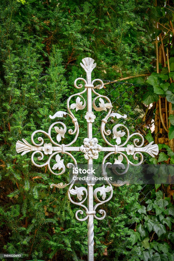Historical wrought iron burial cross at the cemetery of listed village chirch Giesendorf in Berlin-Lichterfelde Architectural specs: monument protection Architecture Stock Photo