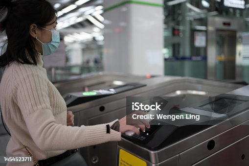 istock Mobile phone to scan the subway 1454523711