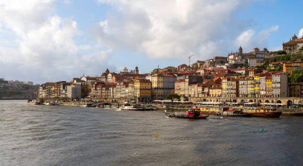 Waterfront in Porto, Portugal on the Douro River with cloudy sky stock photo