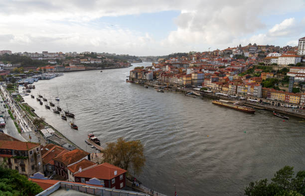 Waterfront in Porto, Portugal on the Douro River with cloudy sky stock photo
