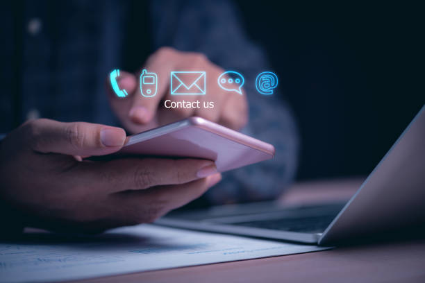 istock businessman hand using smartphone with contact icons  for call support on virtual screen , man select customer support channel (telehpone, mobile , email or chat message) 1454524840