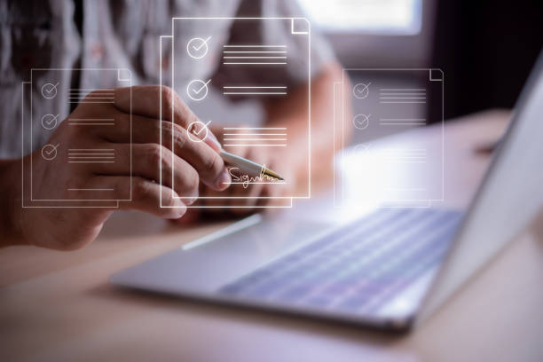 istock man hand sign document on virtual screen , business contract electronic signature, e-signing, digital document management 1454524849