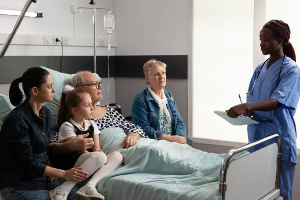 istock African american nurse discussing sickness treatment with elderly senior man 1454524954