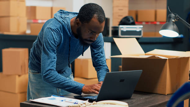 istock African american worker planning products shipment at warehouse 1454526015