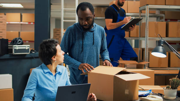 istock Small business owners doing quality control before shipping products 1454526058