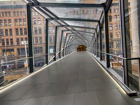 Enclosed pedestrian bridge with Archetectually Exposed Structural Steel