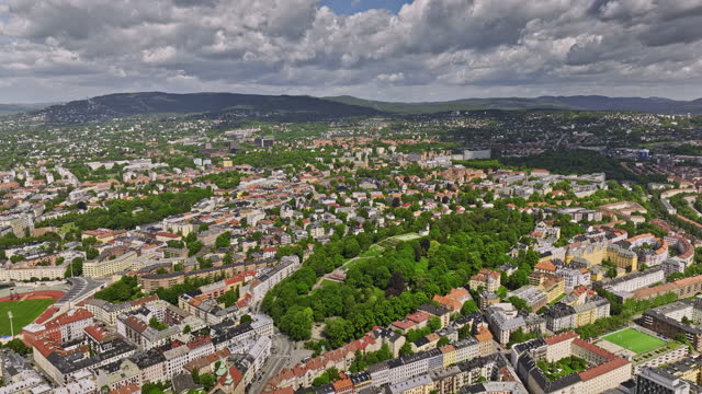 Oslo Norway v39 cinematic birds eye view flyover public urban park capturing the whole cityscape of the st. hanshaugen borough and its residential neighborhoods - Shot with Mavic 3 Cine - June 2022