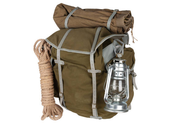 istock Antique vintage backpack with rope and gas lantern 1454529319