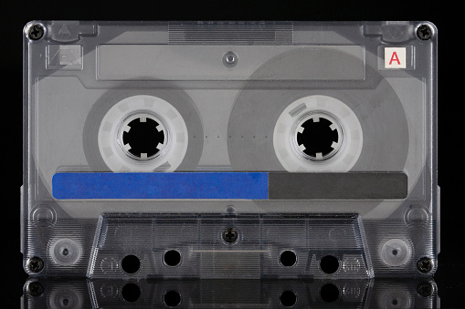 Retro vintage compact cassette A - side on black background