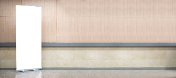 istock Blank roll up stand banner. Blank mockup for presentation isolated on wall background in hospital 1454530742