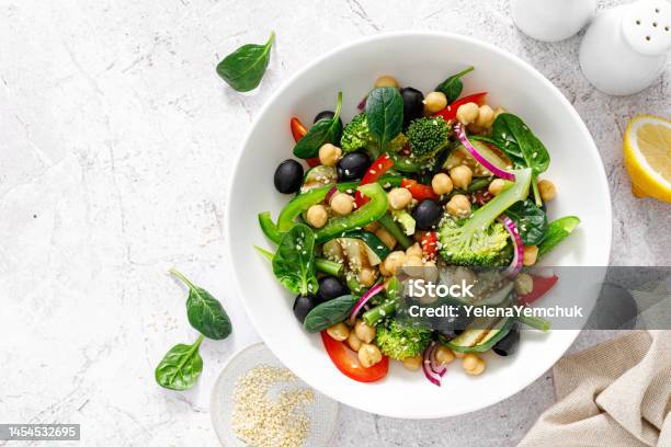 Chickpea And Spinach Vegan Vegetable Salad With Broccoli Sweet Pepper Olives And Grilled Zucchini Mediterranean Diet Healthy Food Top View Stock Photo - Download Image Now