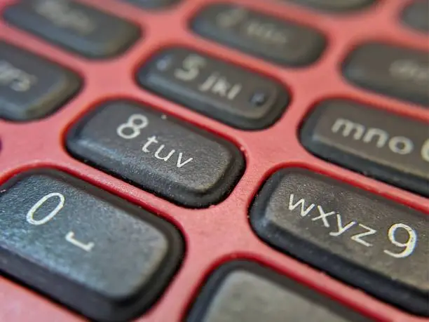 Close-up of red nokia keypad phone