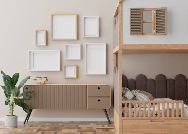istock Various empty picture frames on beige wall in modern child's room. Mock up interior in contemporary, scandinavian style. Free, copy space for picture. Group of frames. Cozy room for kids. 3D render. 1454535343