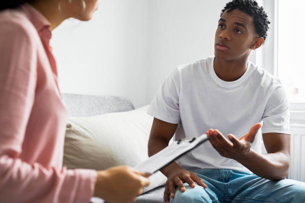 istock Man having a therapeutic session with a psychologist 1454536085