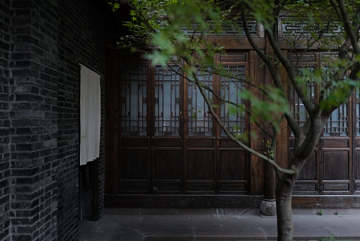 A traditional Chinese yard with a tree