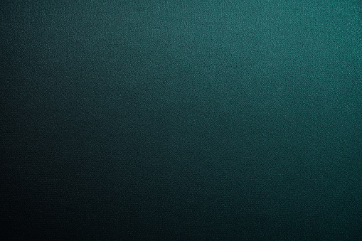 Black blue green abstract background. Gradient. Petrol color. Dark matte background with space for design. Toned fabric surface. Template. Empty.