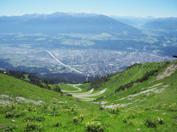 istock Landscape with a zigzag path on the green hillside on a sunny day 1454540027