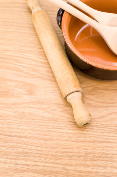 istock terracotta bowl and natural solid wood kitchen tools on a wooden tabletop 1454540648