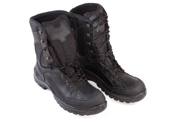 istock Pair of the black high top leather combat boots 1454541708