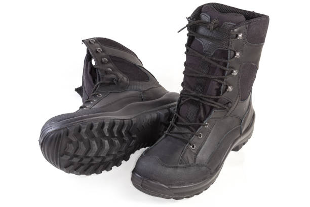 istock Pair of the black high top leather combat boots 1454541810