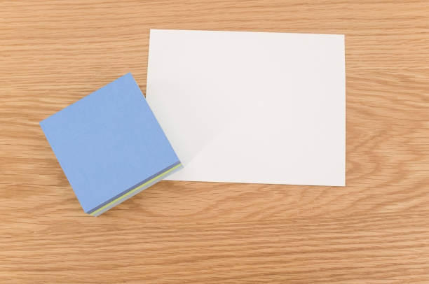 istock blank and colorful sticky note sheets on a wooden worktop background 1454542367