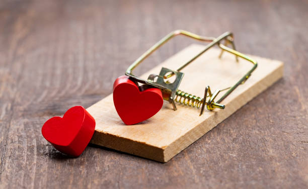 istock Symbol in shape of heart in mousetrap 1454542636