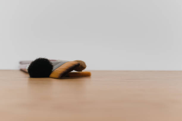 istock fine paintbrushes on a wooden worktop with space for text 1454542686