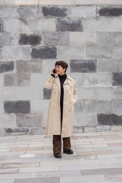 istock Hispanic female talking on the phone at her workplace 1454544974