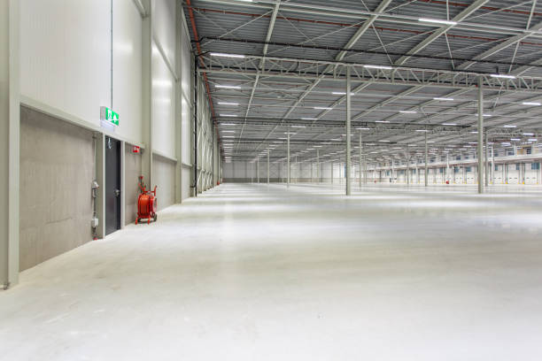 istock Interior of a new empty lighted warehouse ready to be used 1454545178
