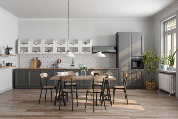 istock Modern Kitchen Interior With Gray Cabinets, Wooden Table, Chairs And Houseplants 1454545188