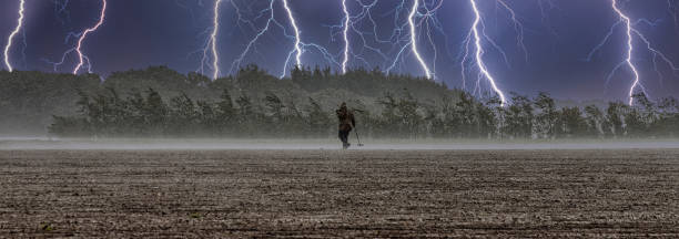 istock Panoramic shot of detectorists looking for ancient metal on the fields in Denmark 1454545646