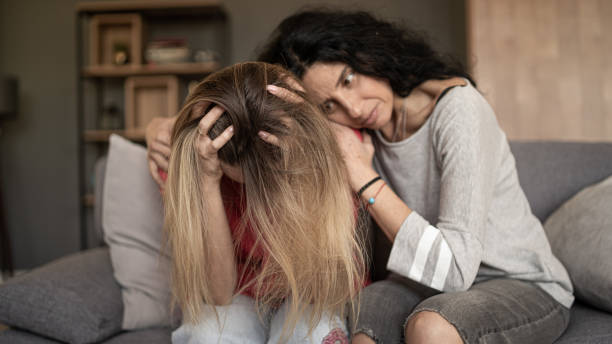 istock Women supporting sad friend trying to solve a problem. 1454546180