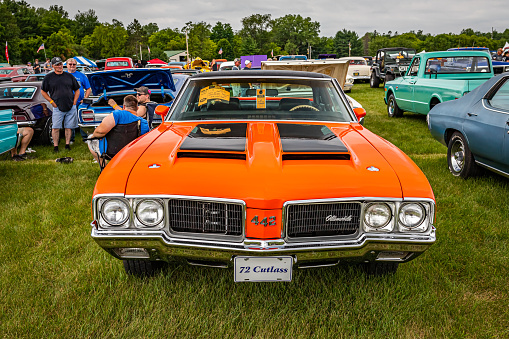 Iola, WI - July 07, 2022: High perspective front view of a 1972 Oldsmobile Cutlass 442 Hardtop Coupe at a local car show.