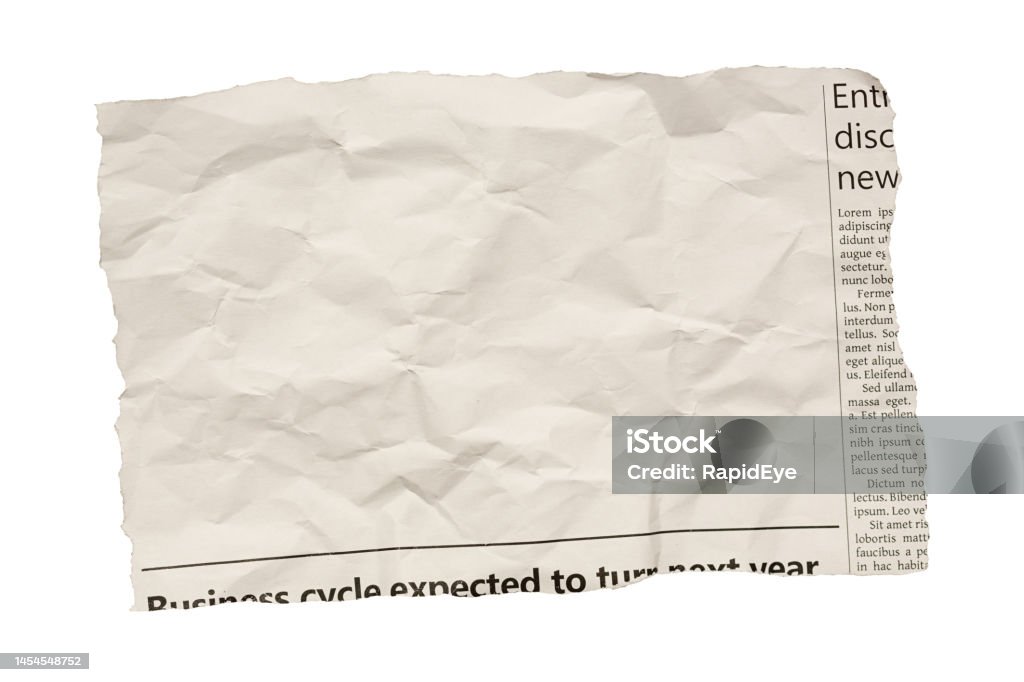 Cutting from a newspaper, isolated on white, with plenty of space for your copy Piece of paper torn from a simulated newspaper, designed by the photographer and free of design copyright. Large blank area in which to insert your copy. Isolated on white. Newspaper Stock Photo