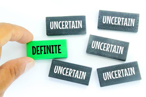 istock colored wooden boards with the words definite and uncertain 1454549569