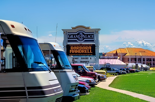Branson Missouri, United States – October 24, 1992: Branson, Missouri, USA October 24, 1992: RVs and mobile homes line the parking lot at The Grand Palace during a performance by Barbara Mandrell.