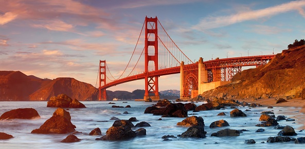 A perspective shot of The Golden Gate Bridge in the sunset, San Francisco.