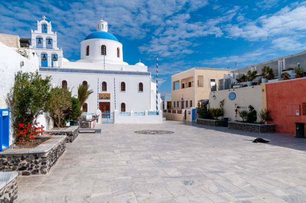 istock Cloudy blue sky over white Santorini view church Oia on a sunny day 1454551648