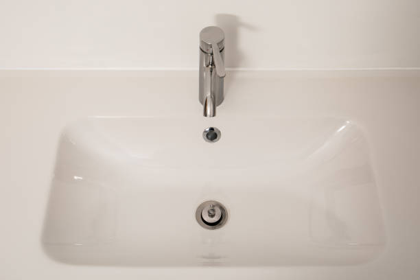 istock White bathroom sink with chrome faucet. Hygiene 1454552144