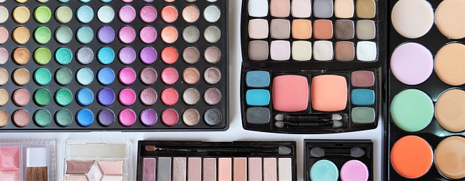 A closeup shot of colorful and different size eyeshadow palettes