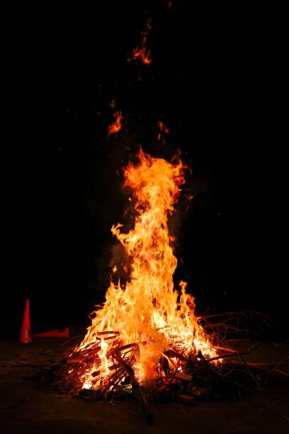 istock Big flame of fire burning straws at night 1454552400