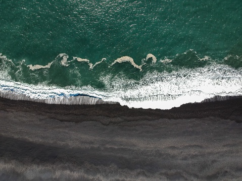 An aerial view strong waves on the beach
