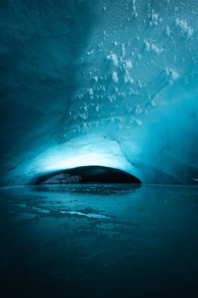 istock Chilling view of a frozen cave with bright light on the wall 1454552555