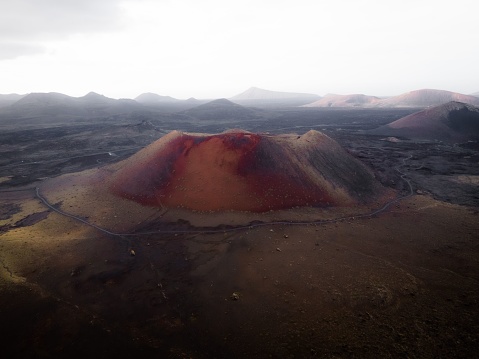 An aerial shot of Mauna Loa volcano in Hawaii with ashes in the  surroundings