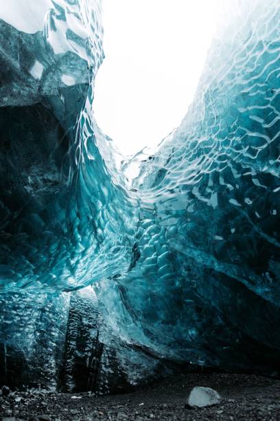 istock Vertical shot of a blue crystal ice cave in Iceland 1454553319