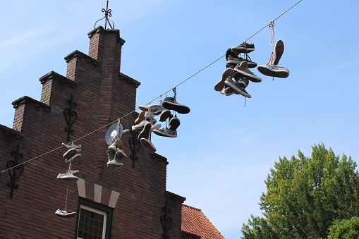 A hanged sneakers on the wire in Eindhoven