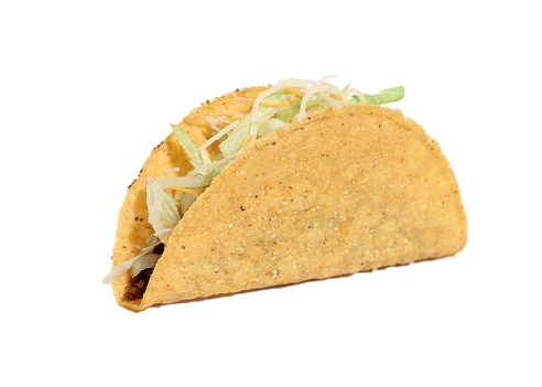 A closeup of a crunchy taco with meat isolated on a white background