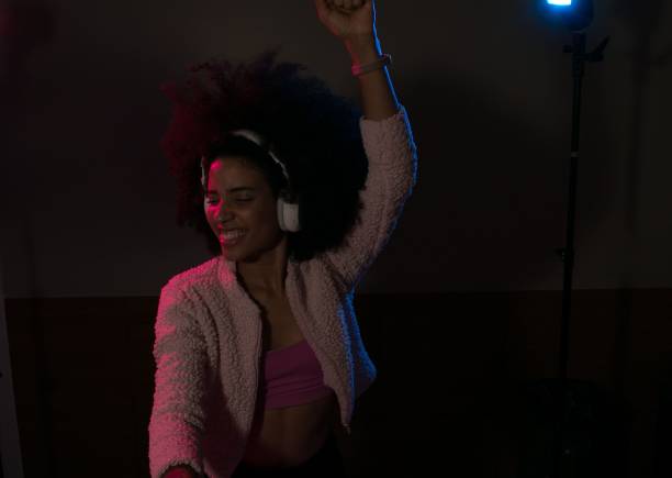 istock Young woman DJ playing music 1454559150
