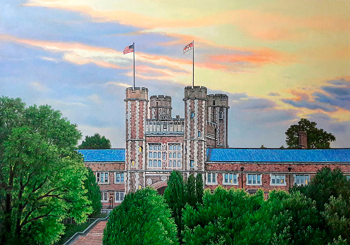 An exterior view of the Brookings Hall in Missouri with trees under sunset colorful sky