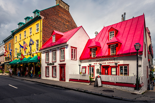 Québec City, Canada - August 22, 2022: View along a street with many stores, restaurants and pubs. Québec City is the capital of the largely French-speaking Canadian province of Québec.